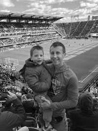 Kevin Mahoney, CFP® and his son at a DC United match in Washington, DC