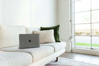 photo of laptop on couch