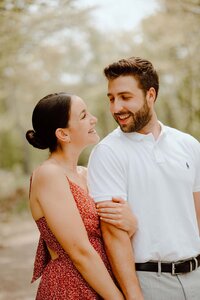 couple smiling in a field