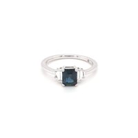 Deep blue sapphire ring with white diamond side stones  in white gold