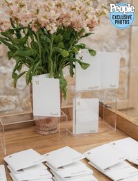 Custom calligraphy on passport holders for guests at Hannah Godwin and Dylan Barbour's wedding