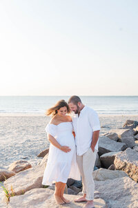 Best maternity photographer in Narragansett, RI maternity photo of husband and wife