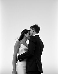 Couple hugging at coastal wedding venue