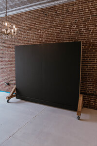 Natural-light photography studio with black backdrop in Troy, MO