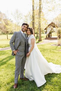 bride and groom posing for portraits during their wedding day at Ramble Creek