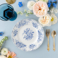 a flat lay with a blue and white plate as the centerpiece