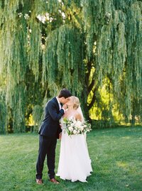 Bride and groom walk up memorial steps at their DC wedding