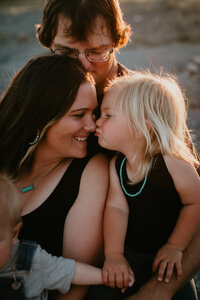 Family photo session on a client’s land in Vida, MT, showcasing a family in a relaxed, outdoor setting. Capturing genuine moments of love and connection against the peaceful backdrop of Montana’s wide-open countryside.