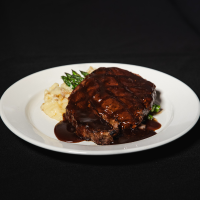 boneless ribeye steak with terragon demi glaze Max Dales Steak and Chop House Restaurant