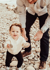 lake ontario photos taken with son holding rocks with his dad