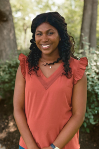 headshot of Patrice smiling