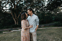 mum and dad share an intimate moment during family portrait session