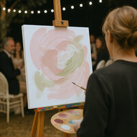 Live wedding painter painting a ceremony scene.