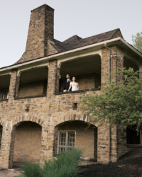 A bride and groom look out over the Ohio River at their wedding venue in Middle Tennessee.