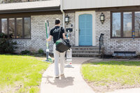 Professional Cleaner entering a home in Eau Claire, WI