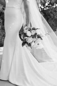 Bride holding her bouquet  in front of veil at El Chorro Scottsdale