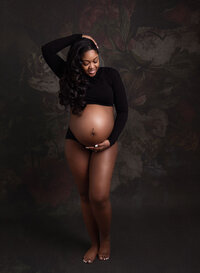 beautiful maternity mom, wearing black top, taken in atlanta studio