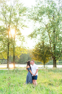 Couple kissing in open field in Ohio