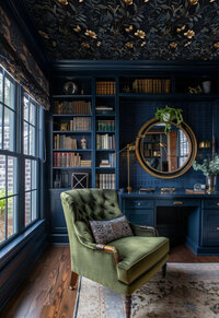 Luxurious photography studio with floral wallpaper, vintage armchair, and elegant lighting used for boudoir sessions