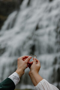 Bride and Groom running away at Skogafoss Waterfall