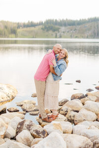 Couple posing together at their engagement session in the Snowy Range Mountains at Sugarloaf near Laramie, Wyoming