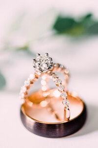 Engagement ring and wedding bands stacked in grooms wedding bands rose gold  by Grand Rapids Wedding Photographer Stephanie Anne Photography