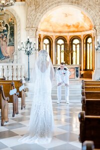 military bride and groom kissing under veil catie ann photography