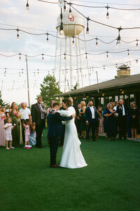 bride and groom kissing after wedding ceremony