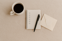 Flat lay of an open notebook, pen, and warm lighting—symbolizing self-reflection and confidence-building for online dating.

