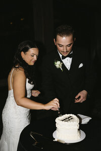 Couple cutting their cake on their wedding day.