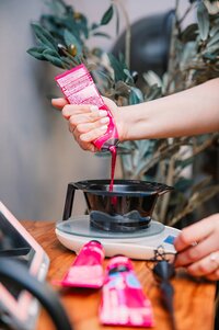 Hand mixing hair color at hair salon