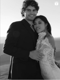 Black and white portrait of bride and groom at sunrise in Moab desert