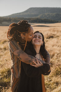 Couple kissing eachother in photoshoot in albuquerque new mexico.