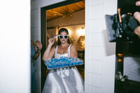 Bride delivers blue jello shots during her reception at Firefly Lane.