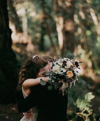 Bridal bouquet featuring roses and anemones at a wedding at Alila Ventana Big Sur