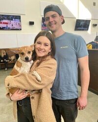 event planner milwaukee posing with husband and dog