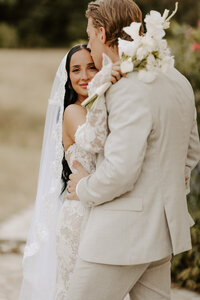 Outdoor barn wedding, bride and groom run through reception area in Moncton Canada