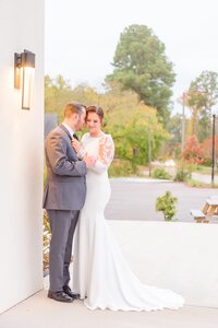 A couple spends a quiet moment at the Distillery front entrance.