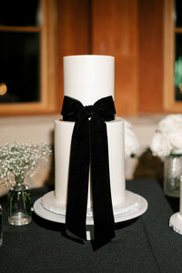 Modern wedding cake with bow planned by Bianca Nichole and Co