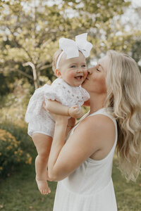 A Mom and baby posing for a photo