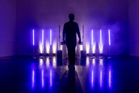 silhouette of a man standing on a stage