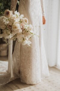 bride holding her bouquet at her side