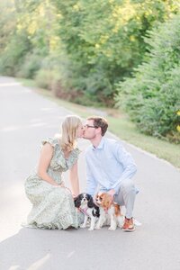 Nashville family kissing and posing with their two doggies