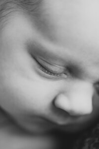 black and white photo of baby close up