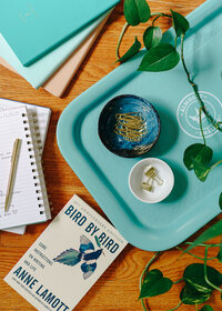 Flatlay of small business copywriting writing tools and resources on Kat Jackson's desk.
