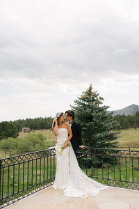 Bride and groom holding each other during their destination wedding at Greystone Castle in Boulder, Colorado.Photo by Jaimee Raneigh Photography, a Nashville based Wedding Photographer.