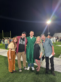 family photo of jennifer mosier photography with her family at her son's high school graduation