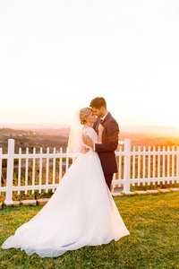 sunset wedding couple photography  with orange and yellow setting sun