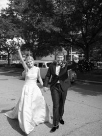 Bride and groom walk up memorial steps at their DC wedding