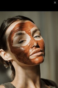 Woman with an anti-aging plumping mask on her face